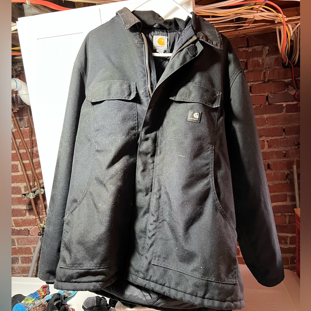 Men’s Carhartt Jacket. Has paint stain on sleeve as show in the picture.